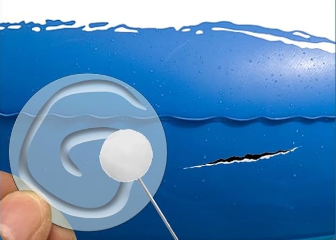Application d'une colle sur un patch